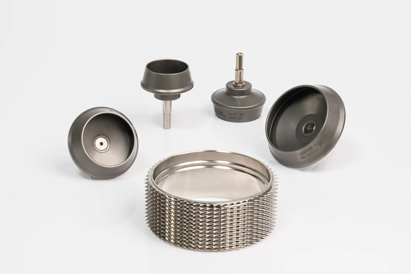 JSM opening roller with serrated metallic card clothing shown with G630 BD and TT646 BD rotor cups for open-end spinning machines.